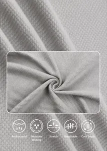 Extreme close-up macro detail of breathable ice silk knit fabric showing waffle texture