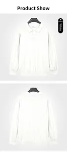 Detailed view of white long-sleeved polo knit sweater showing front and back ribbed texture