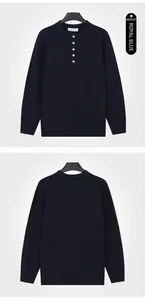 Detail view of a navy blue men's knitted henley sweater with buttoned collar and ribbed texture.