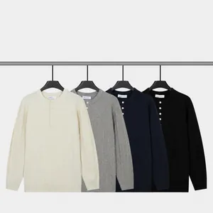 Men's solid color long sleeve Henley knit sweaters available in four classic colors