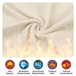 Detailed texture of thick cream-colored ribbed knit fabric showing warmth and breathability