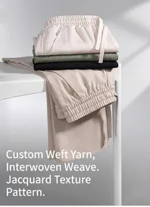 Detailed view of breathable linen-blend men's straight trousers with jacquard texture