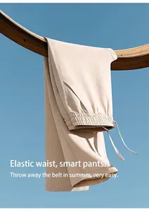 Close-up of beige breathable men's trousers with comfortable elastic waistband