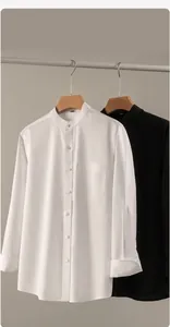 Detailed view of textured long-sleeve Henley shirt with stand collar and pocket
