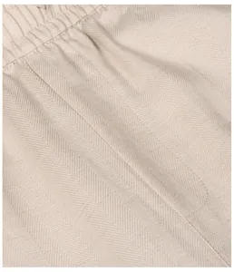 Macro detail of breathable Lyocell linen fabric with herringbone pattern for men's trousers