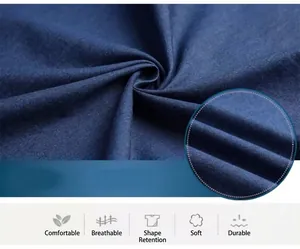 Detailed macro view showing the high-quality texture and weave of dark blue cotton denim fabric