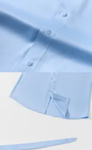 Macro view showing durable buttons and tailored hem of blue satin long sleeve dress shirt