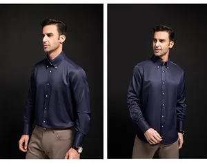 Detail view of men's navy blue long-sleeved dress shirt with crystal buttons.