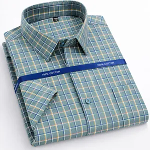 Detailed view of a blue plaid 100% cotton men's short-sleeve non-iron business casual shirt.