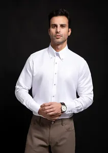 Close-up of elegant white long-sleeve business shirt with decorative diamond buttons