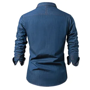 Back view of a classic blue long-sleeved cotton denim shirt with orange stitching