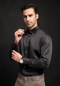 Close-up of black business casual long-sleeve shirt with sparkling drill buttons