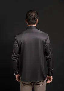 Back view of premium black long-sleeved shirt for men featuring stylish rhinestone buttons.