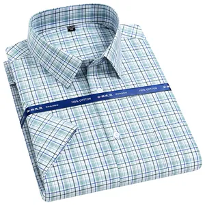 Detail view showing texture and pattern of 100% cotton men's plaid short sleeve shirt