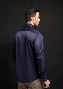 Back view of men's navy blue silk-like long sleeve shirt with cuff diamond buttons