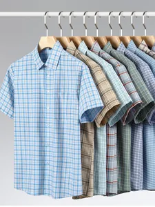 Collection of men's short-sleeved 100% cotton plaid shirts hanging on wooden hangers