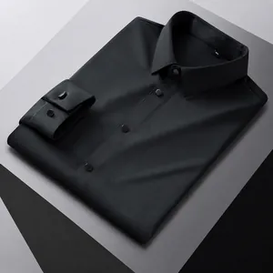 Detail view of a black long-sleeved dress shirt with stand collar and cufflinks