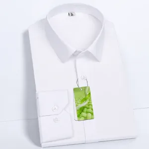Professional detail shot of a folded white bamboo fiber men's business dress shirt
