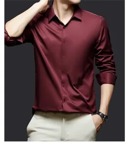 Macro view of burgundy satin dress shirt showing luxurious wrinkle-resistant fabric