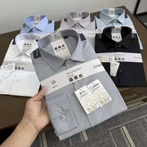 Detail view of folded luxury mulberry silk and modal blend men's formal shirts in multiple colors