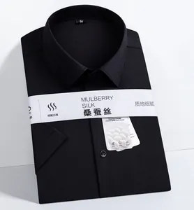 Detail of folded black men's mulberry silk short sleeve shirt with packaging band