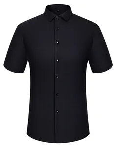 Front view detail of a classic black short-sleeved shirt in premium silk blend fabric