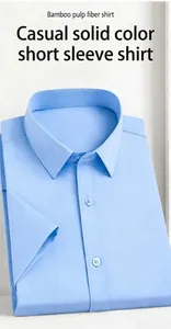 Close-up of a light blue bamboo fiber short-sleeved shirt with neat folding details.