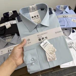 Close-up view of a premium mulberry silk and modal blend formal men's shirt in light blue
