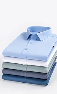 Detail view of stacked bamboo fiber men's short-sleeve shirts in multiple colors