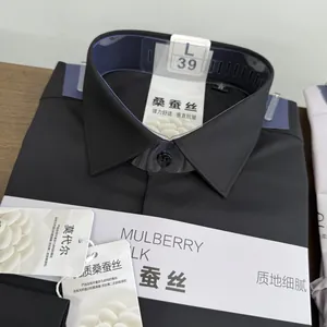 Close-up of black mulberry silk blend men's formal shirt showing collar and labels