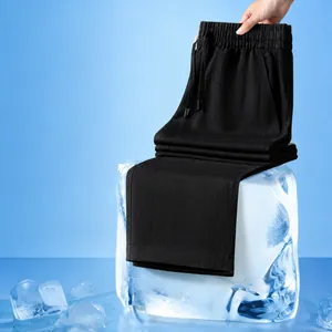 Breathable black linen pants with Lyocell material detail on ice block