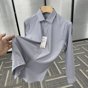 Close-up of grey silk and modal blend men's dress shirt showing fabric texture.