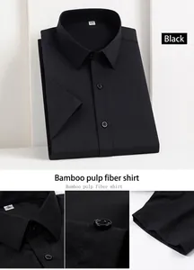 Detailed view of black bamboo fiber men's short sleeve work shirt fabric and buttons