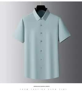 Front view of a men's light blue silk short-sleeve shirt with point collar on a hanger.
