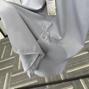 Close-up of premium mulberry silk and modal blend fabric on light blue dress shirt