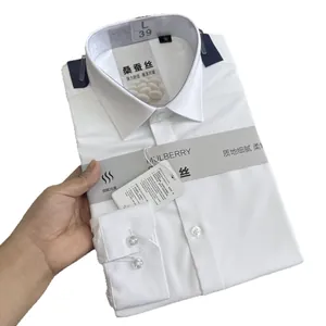 Folded premium white men's dress shirt made from soft mulberry silk and modal blend