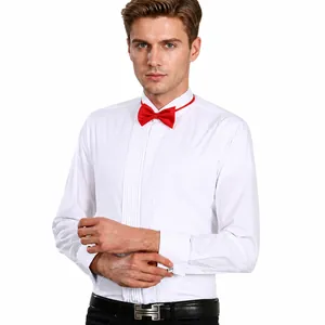 Detailed shot of a classic white men's tuxedo shirt with a red bowtie and pleats