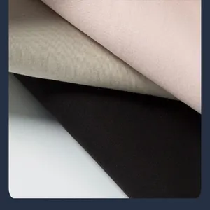 Macro detail of breathable Lyocell Tencel T-shirt fabric in pink, grey, and black.