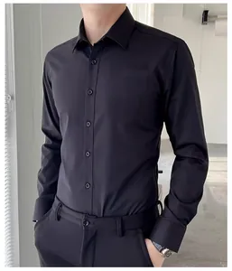 Close-up of a men's professional black long-sleeved business dress shirt for formal events
