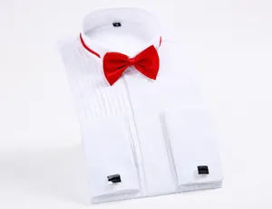 Detailed view of a white wing-collar tuxedo shirt with red bow tie and cufflinks