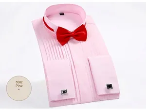 Detail view of pink pleated tuxedo shirt with red bow tie and stylish black cufflinks