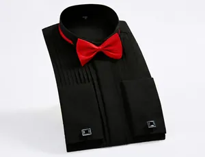 Close-up of black tuxedo shirt with pleated front, red bow tie and elegant silver cufflinks