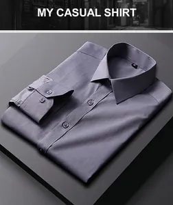 Détail d'une chemise habillée formelle gris-bleu pliée montrant la texture premium