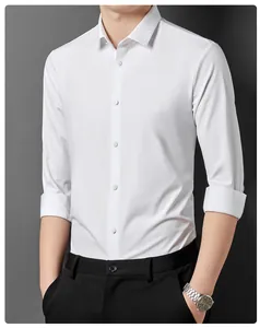 Detail of white long-sleeved non-iron shirt showing button placket and fabric texture