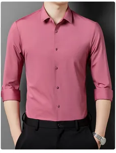 Close-up detail of a dusty rose men's long-sleeved dress shirt with matching buttons