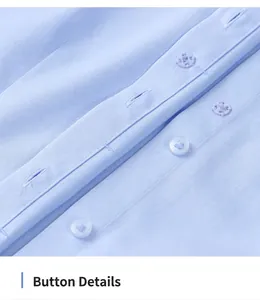 Macro detail shot showing blue resin buttons on a light blue non-iron cotton shirt