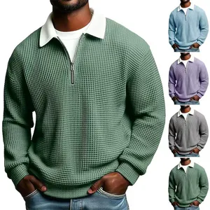 Waffle knit men's sweatshirt featuring a white polo collar and half-zipper detail