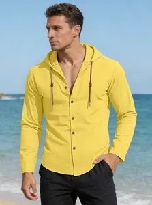 Bright yellow long sleeve hooded cotton shirt for men displayed in a casual beach setting.