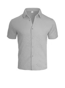 Detail view of the 3D geometric jacquard texture on this breathable grey men's summer shirt