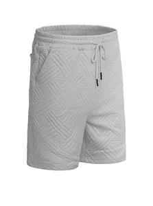 Macro view of light gray men's jacquard shorts featuring textured fabric and drawstrings